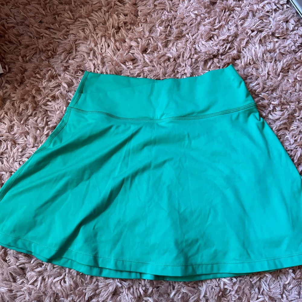 Green crossover tennis skirt